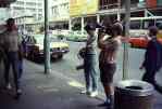 people filming on Auckland street   